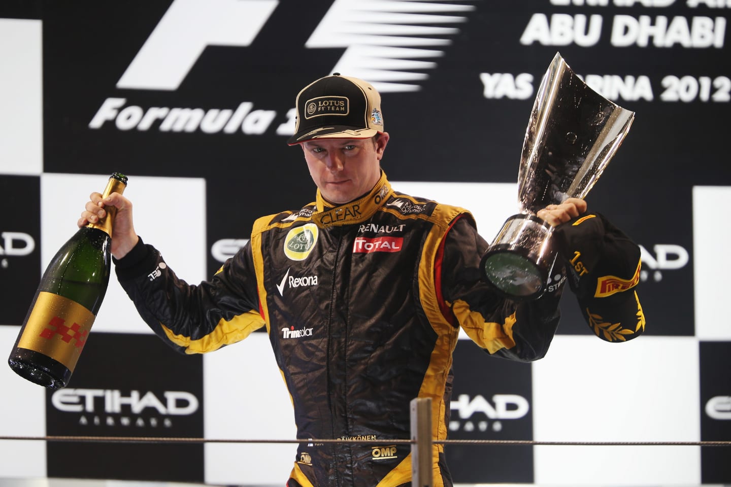 ABU DHABI, UNITED ARAB EMIRATES - NOVEMBER 04:  Kimi Raikkonen of Finland and Lotus celebrates on